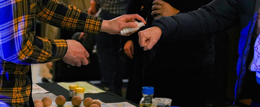 Samples are handed out at a stall during an expo for start-ups